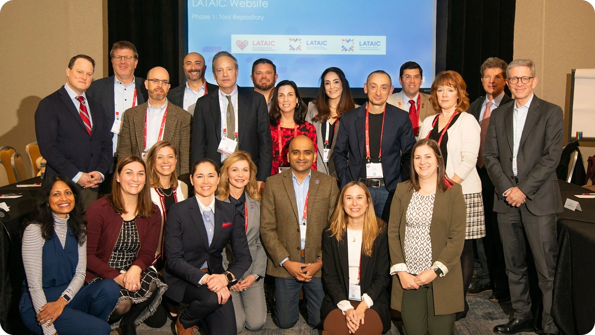 Large group of LATTICE™ team members in front of a screen