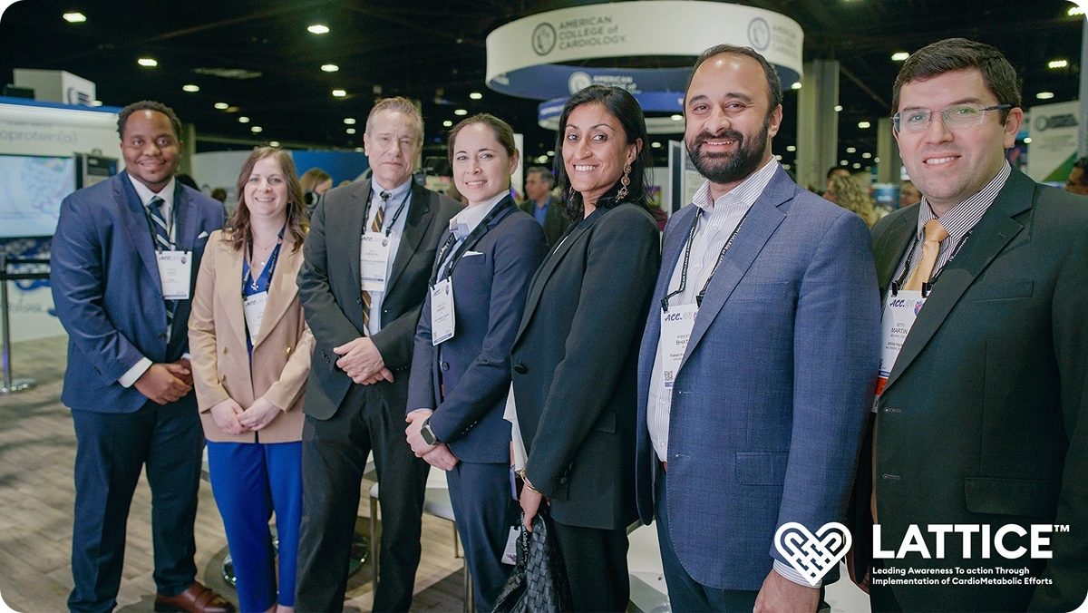 Seven LATTICE™ Consortium members posing together in the ACC conference exhibit hall